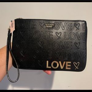 Victoria Secret- Wristlet Black & Gold embossed “Love” logo - faux leather -NWT